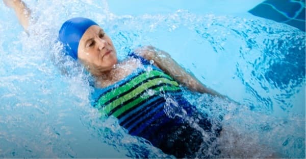 MyIgSource community member Ann P. swimming in a pool.